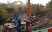 Construction of the retaining wall on Dame Dorothy Street to facilitate future road widening. Sheet piles are being pushed 13 metres into the ground to support the widened road.