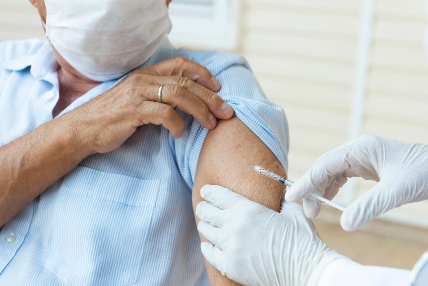 stock image of someone being vaccinated