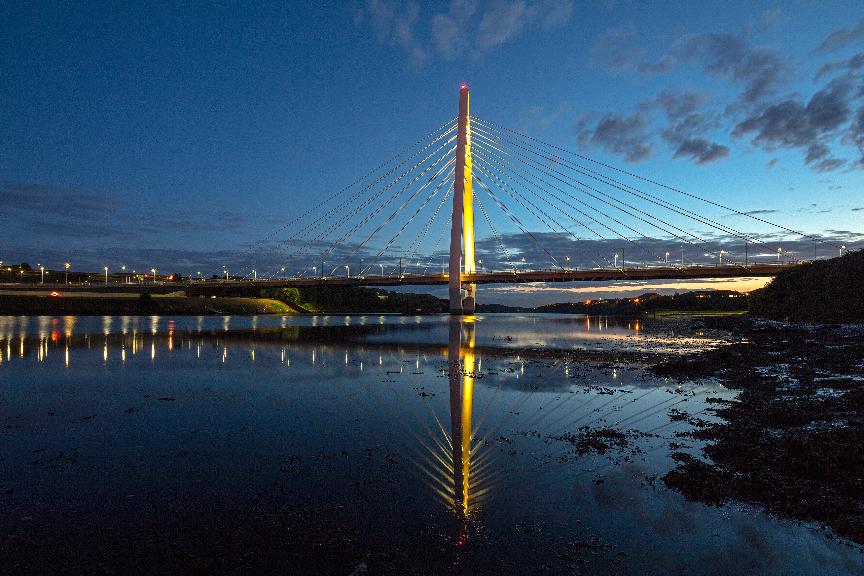 Northern Spire bridge lit yellow