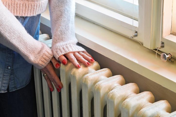 Radiator and lady's hands