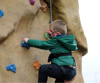 Sara climbing wall